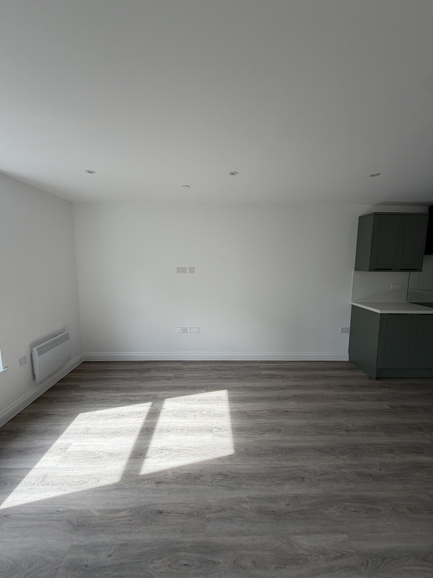 Living space with afternoon light across the floor